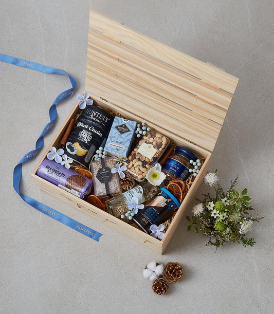 Deluxe wooden gourmet gift hamper with caviar chips, chocolate, honey, coffee, and artisan treats