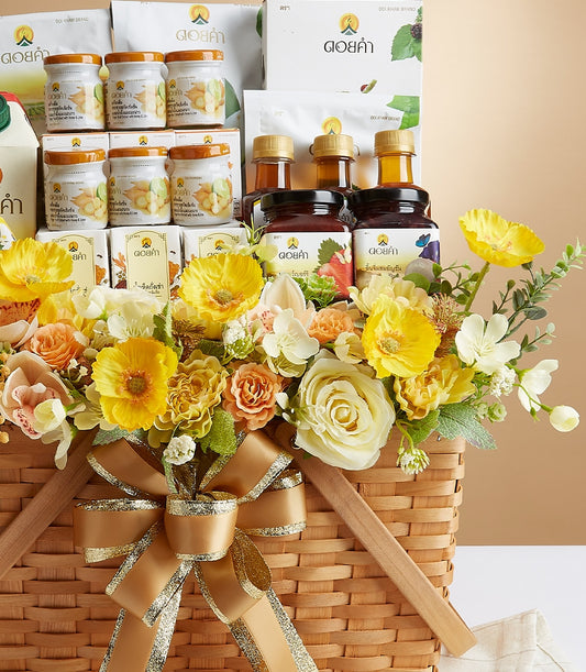 Premium Doi Kham highland gourmet basket with honey, nuts and jams, adorned with golden ribbon and yellow-orange flowers