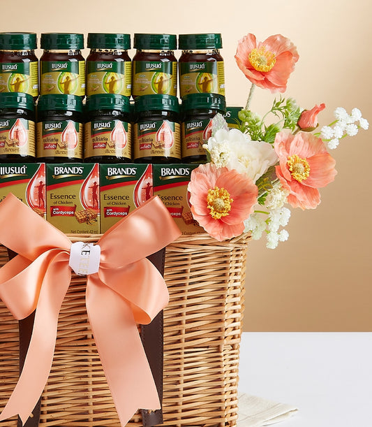 Wicker gift basket with chicken extract soup, health supplements, and peach ribbon bow