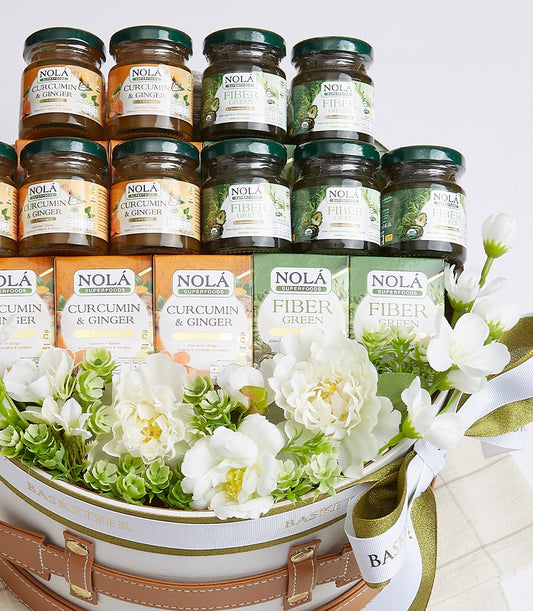 Nola's Medley of Goodies wellness gift basket with curcumin, ginger, and fiber supplements in glass jars and boxes