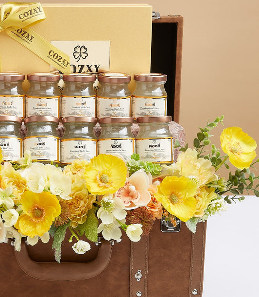 Premium bird's nest delicacies hamper with twelve glass jars in luxury leather suitcase, yellow and white florals