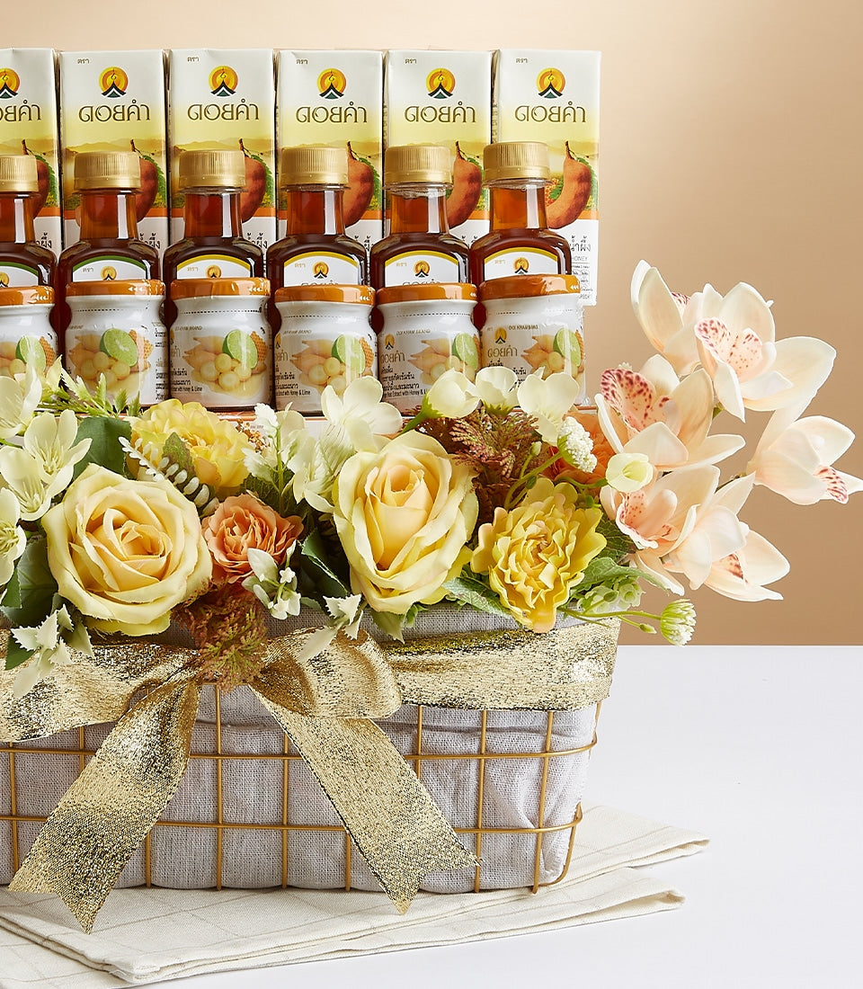 Premium wellness gift basket with gold wire design, fresh florals, and natural health products from Doi Kham