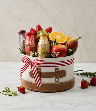 White gift box filled with fresh strawberries, kiwi, apple, pear, and Lily Fresh juices, get well soon fruit hamper