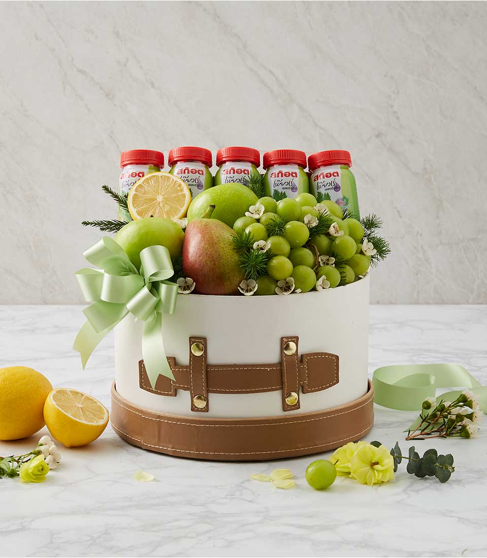 Premium fruit and wellness gift box with fresh apples, pears, grapes, and celery juice bottles, get well hamper