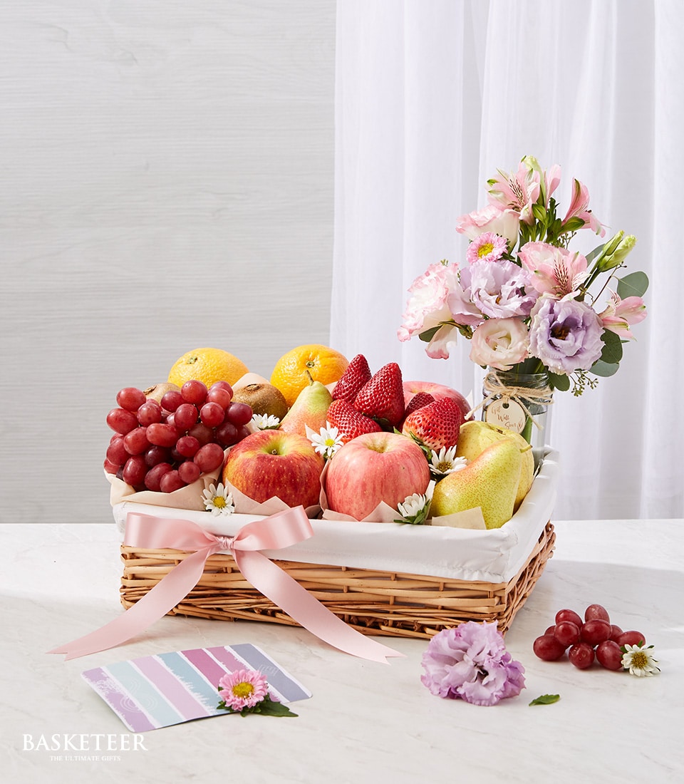 Fresh fruit basket with grapes, apples, pears and berries plus pink flower arrangement, get well gift