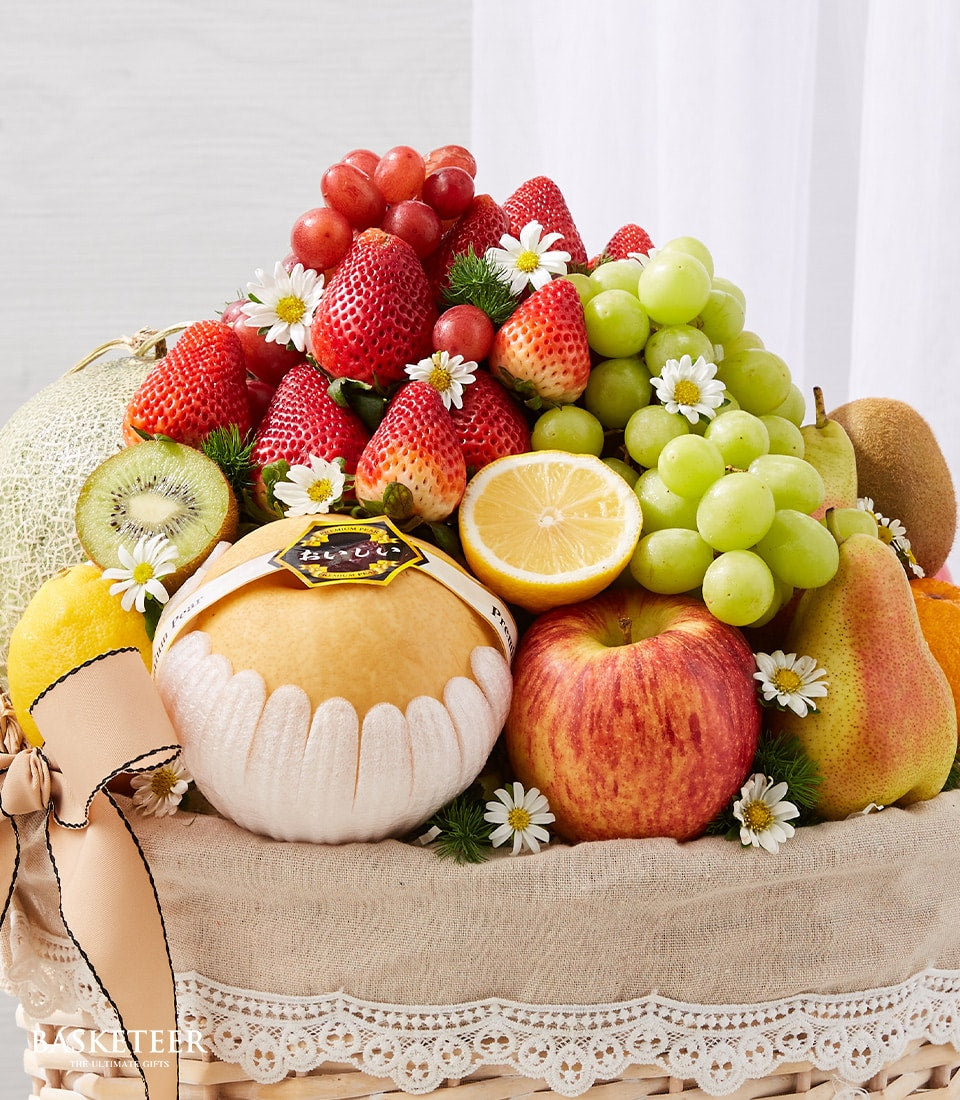Luxe fresh fruit gift basket with pears, apples, grapes, strawberries and white flowers, get well soon arrangement