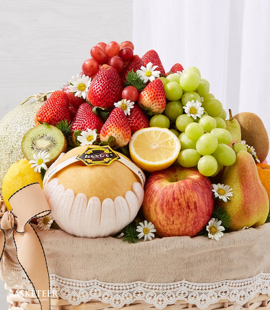 Luxe fresh fruit gift basket with pears, apples, grapes, strawberries and white flowers, get well soon arrangement
