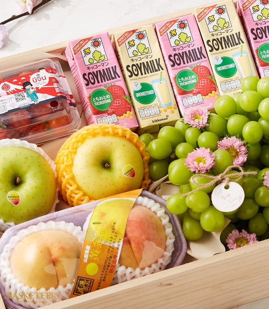 Premium fruit and gourmet gift box with fresh grapes, apples, peaches, soymilk, and cherry tomatoes in wooden presentation
