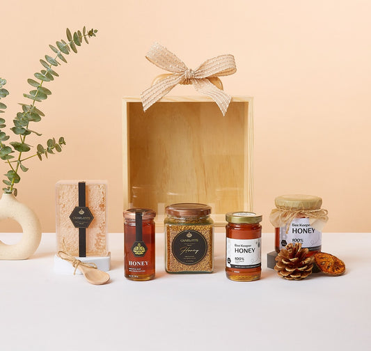 Honeycomb Harmony gift box with raw honey, bee pollen, eucalyptus, and artisan ceramic vase