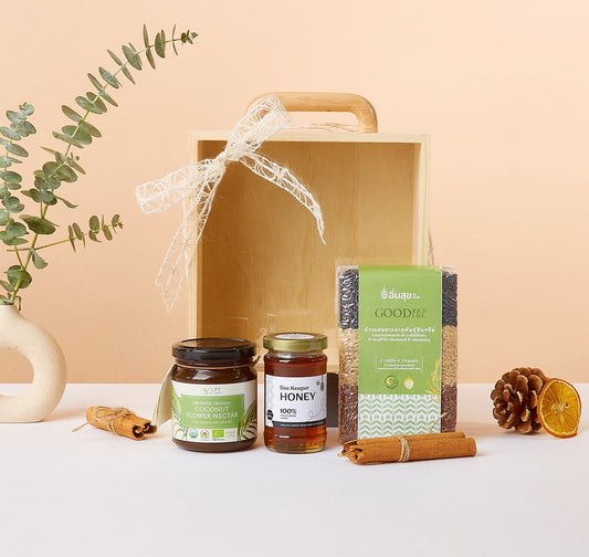Wellness Wonders organic gift box with coconut nectar, honey, multigrain rice, and natural botanicals in light-wood