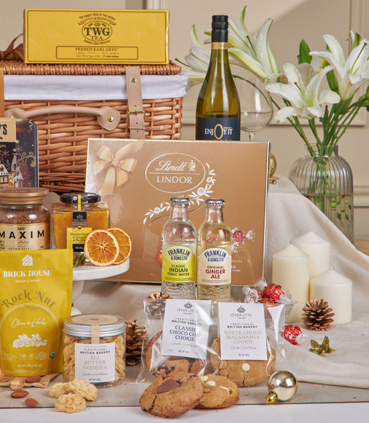 Luxury New Year gourmet hamper with Lindt chocolates, French Earl Grey tea, white wine, premium cookies, and artisan spreads