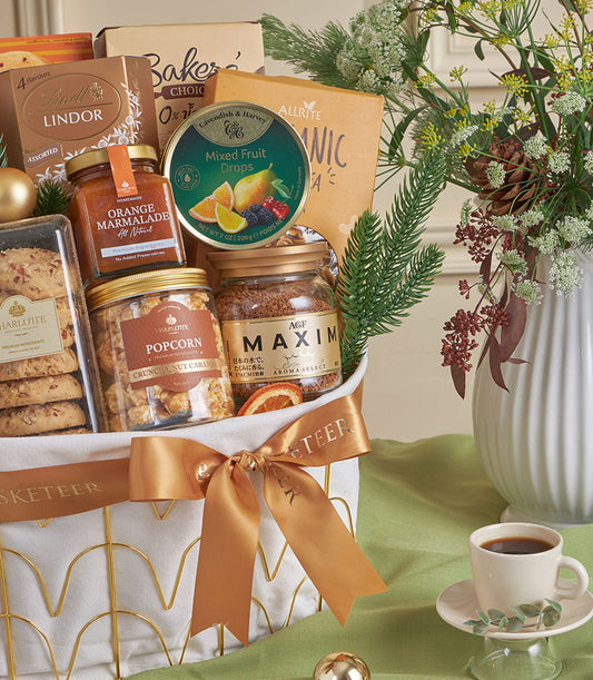 Gold wire gourmet gift basket with chocolates, coffee, and caramel popcorn, perfect for New Year gifting