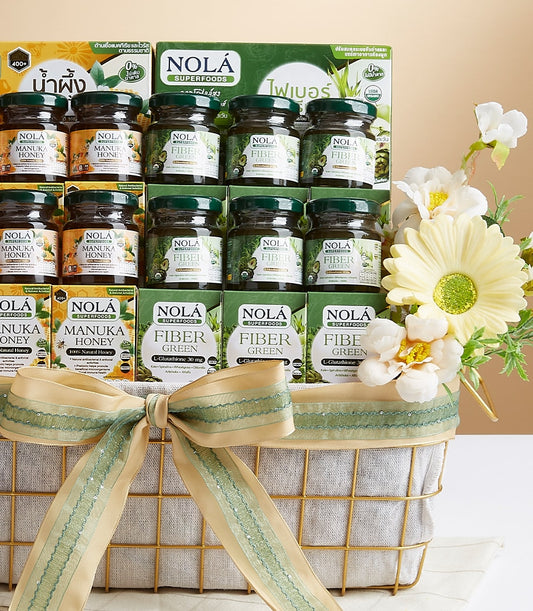 Gold wire gift basket with Manuka honey and Fiber Green superfoods, tied with beige and green bow