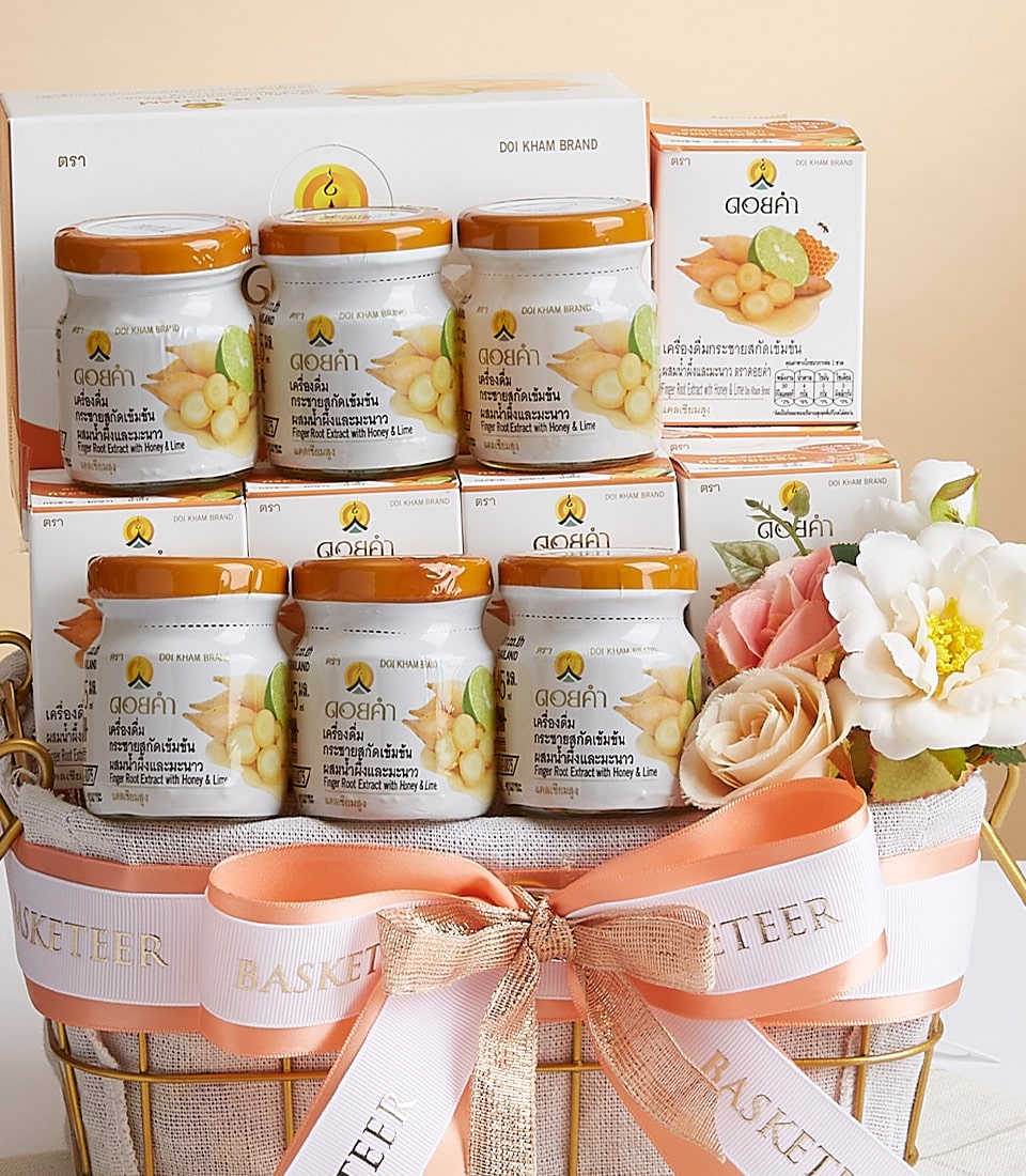 Premium turmeric and finger root extract gift basket with honey and lime in gold wire presentation