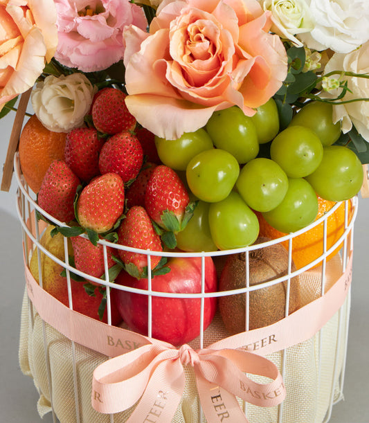 Premium fruit basket with peach roses, strawberries, and fresh citrus for birthday celebrations