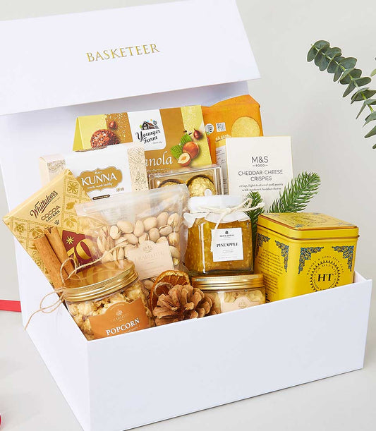 Luxury gourmet gift basket with pistachios, pineapple jam, and artisan snacks for New Year celebrations