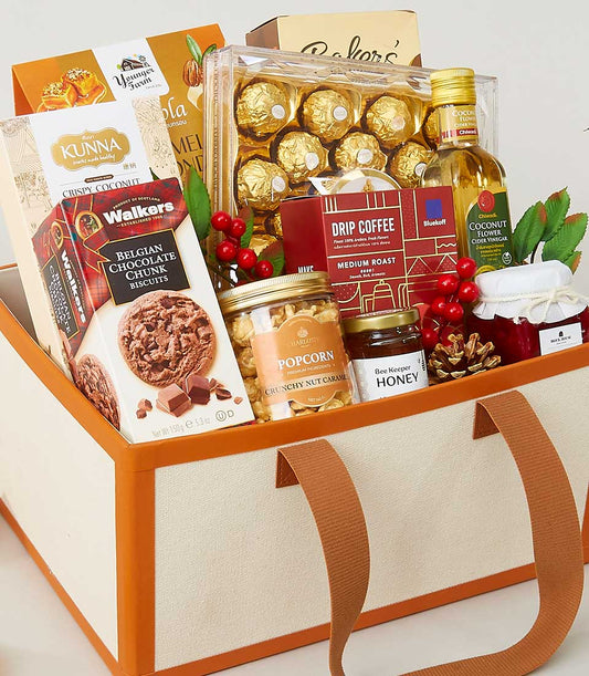 Cream fabric New Year gift hamper with gourmet chocolates, specialty coffee, honey, and artisan snacks in elegant