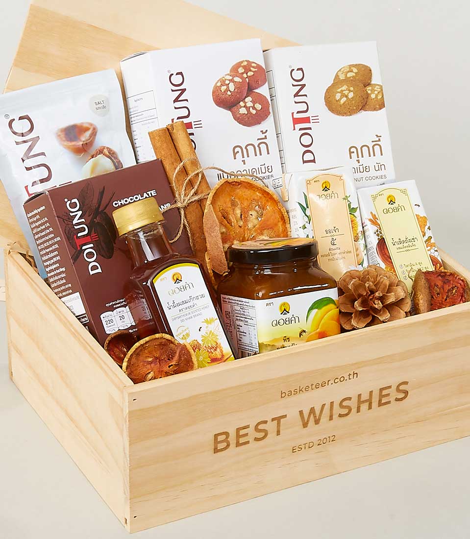 Wooden gift box with Doi Kham and Doi Tung gourmet foods, honey, jam, cookies, nuts, and tea