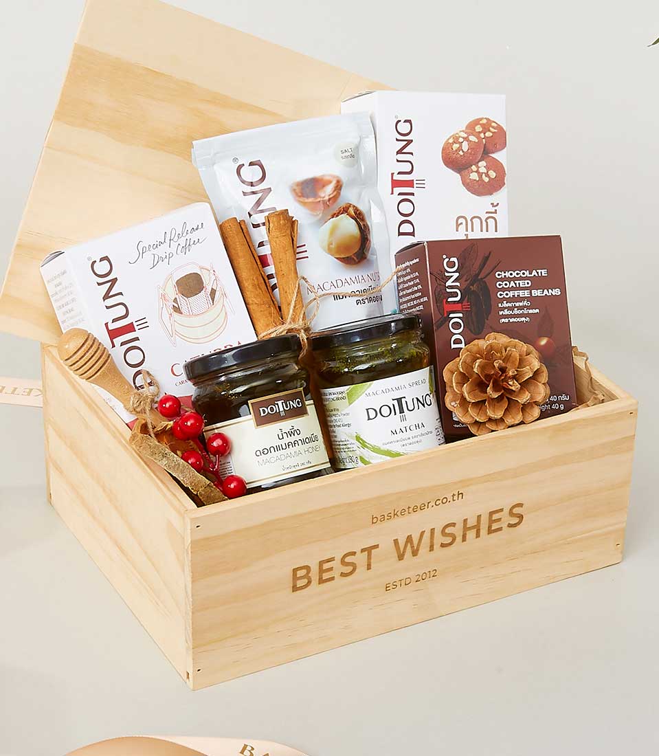 Light wooden gift box filled with gourmet coffee, macadamia nuts, honey, matcha spread, cookies, and chocolate-covered beans