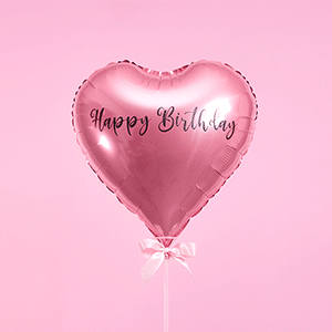 Pink heart-shaped Happy Birthday balloon with rose gold foil finish and satin ribbon