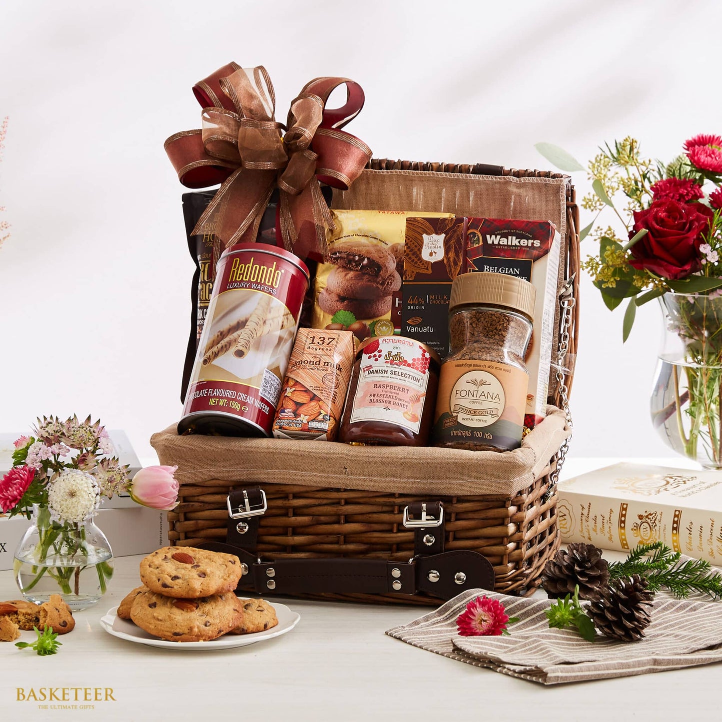 Luxury Imports Epicurean hamper with Belgian biscuits, wafers, coffee, and jam in woven wicker basket with bronze ribbon bow