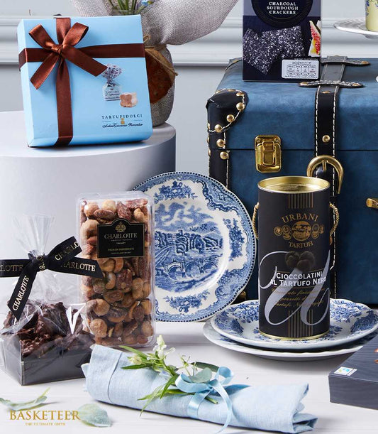 Luxury gourmet gift basket with Italian truffles, premium chocolates, nuts, dried fruits, artisan crackers and blue
