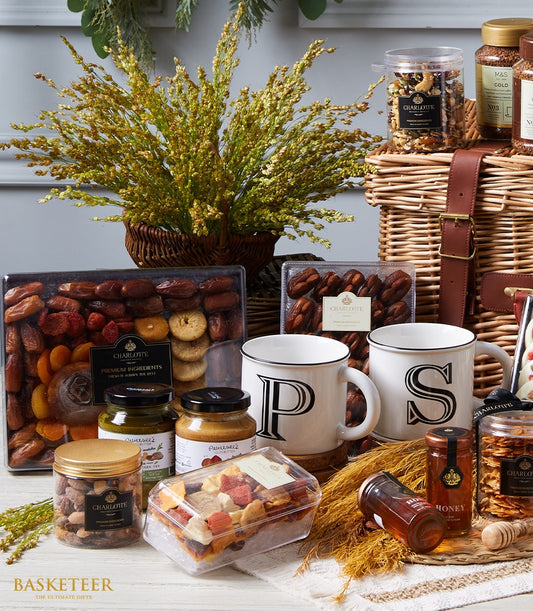 Luxury wicker hamper with gourmet foods, personalised ceramic mugs, dried fruits, nuts, and honey