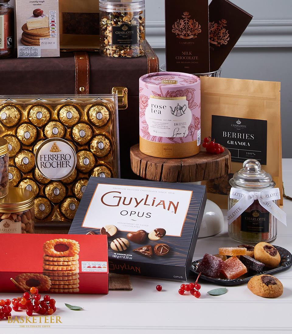 Luxury International Elegance hamper with Ferrero Rocher chocolates, Guylian truffles, rose tea, and gourmet treats in
