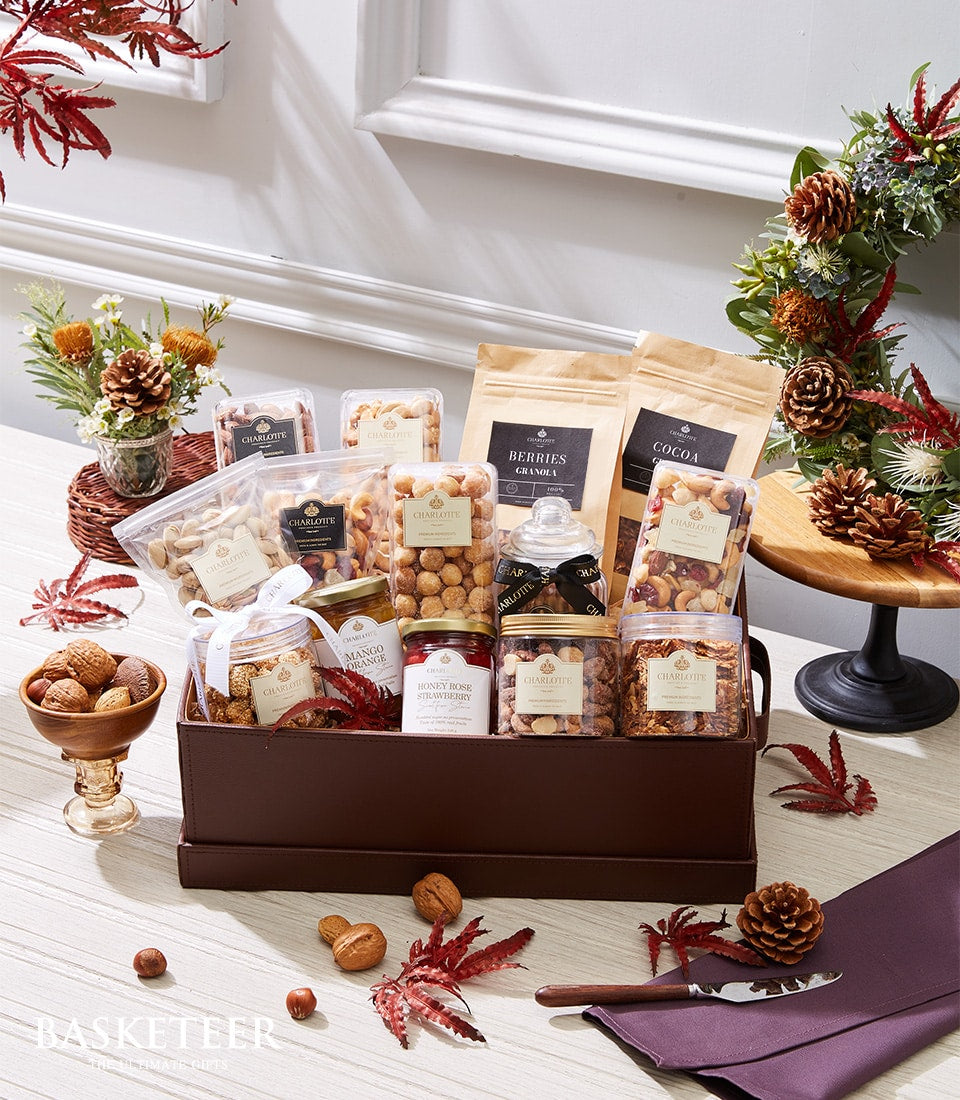Nutri Bite Bliss gourmet gift basket with granola, nuts, honey preserves, and dried fruits in dark brown leather box