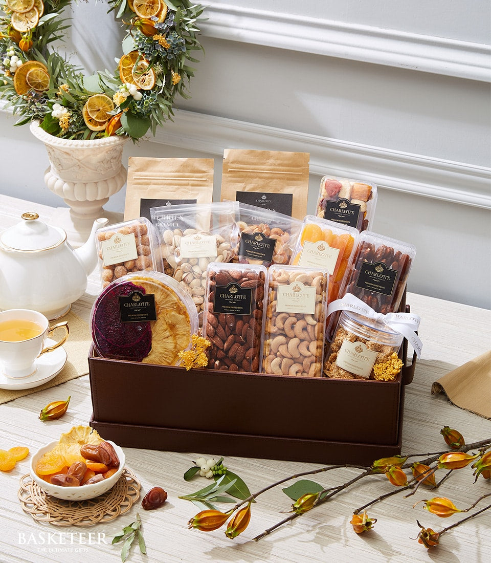 Luxurious dried fruit and nuts gift set in leatherette tray with almonds, cashews, pistachios, apricots, dates, and exotic
