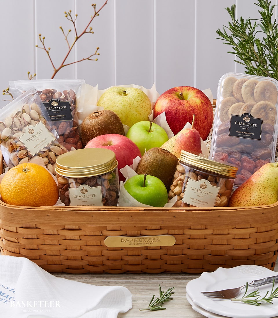 Premium fruit and wellness gift basket with fresh apples, pears, kiwis, almonds, pistachios, and dried fruits for get well