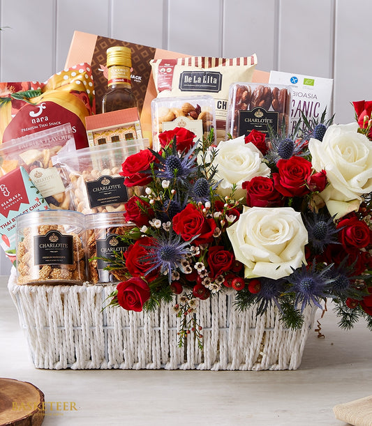 Premium Thai gourmet gift basket with red and white roses, thistles, and berries