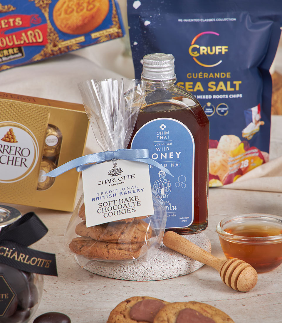 Classic blue gourmet gift hamper with chocolates, honey, cookies, and artisan snacks for New Year