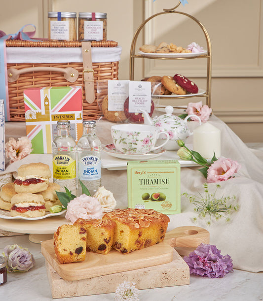 Charlotte Bakery afternoon tea set with almond fruit cake, cream scones, toning waters, Twinings tea, and tiramisu chocolates
