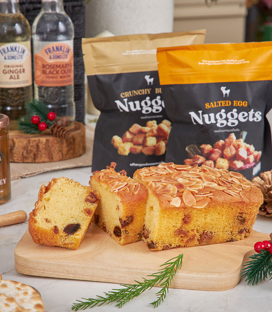 Premium cheese and gourmet snack hamper with almond cake, artisan crackers, and craft beverages