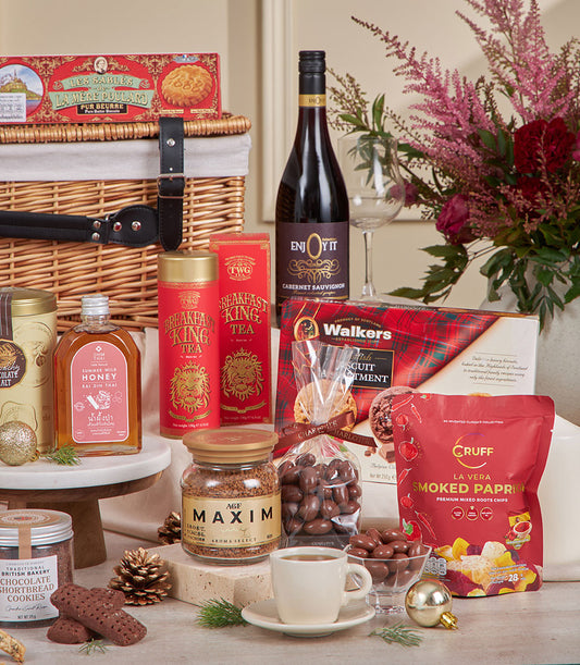 Grand Celebration red gourmet hamper with wine, tea, chocolates, and festive flowers for New Year gifting