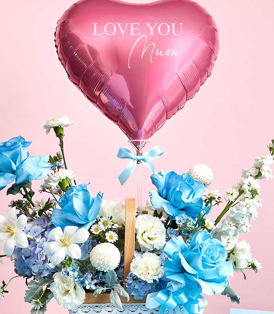 Pink heart balloon and blue-white rose basket with lilies, perfect for Mother's Day