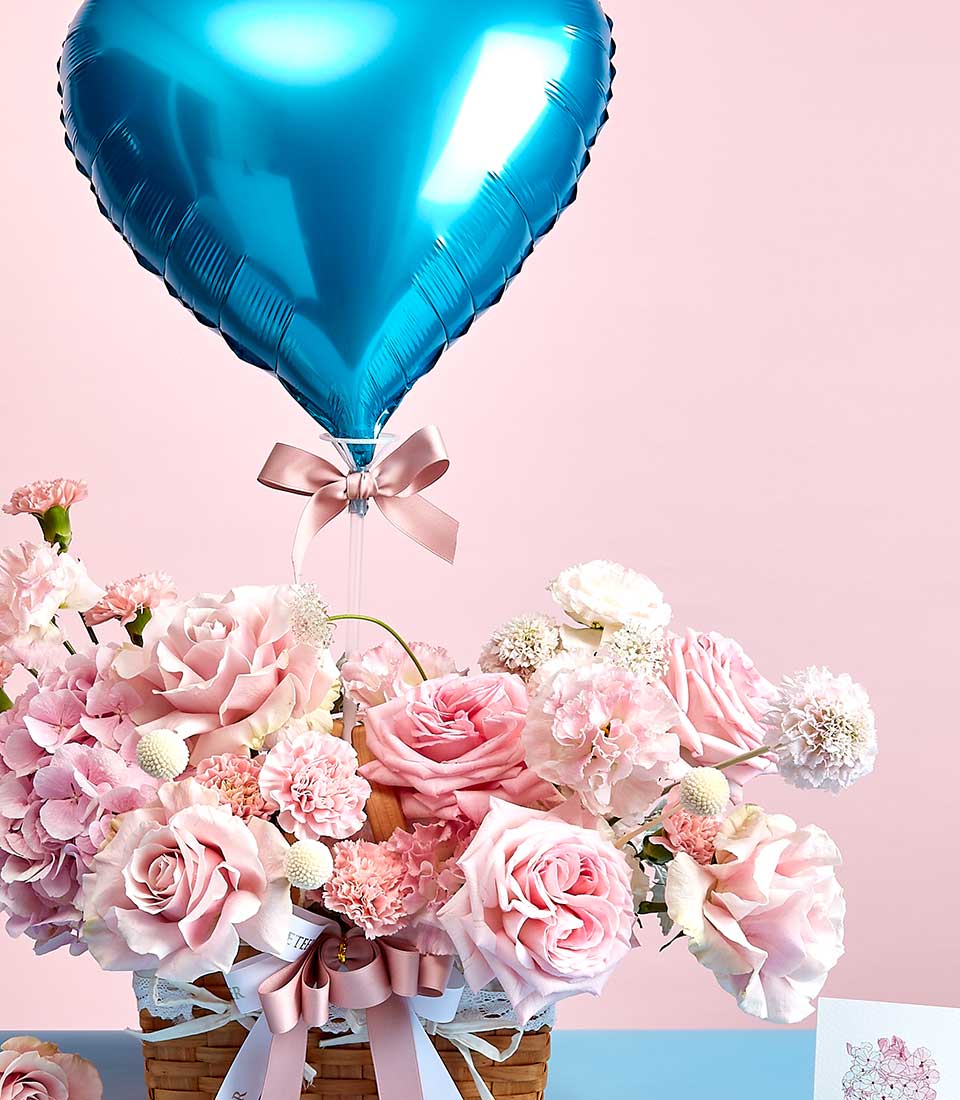 Pink rose and hydrangea basket with blue heart balloon, Mother's Day flowers by Basketeer