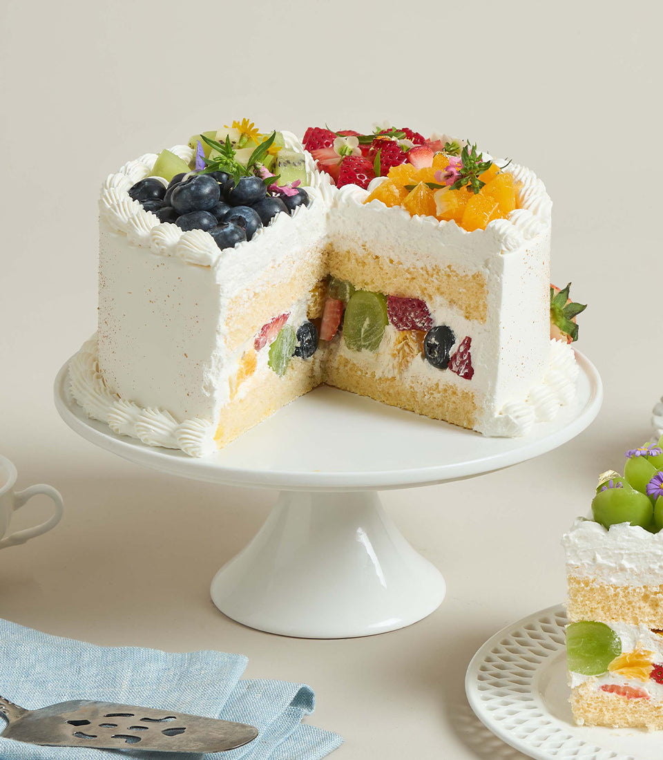 Charlotte Bakery's vibrant artisan custom cake, a round chiffon soft cream cake