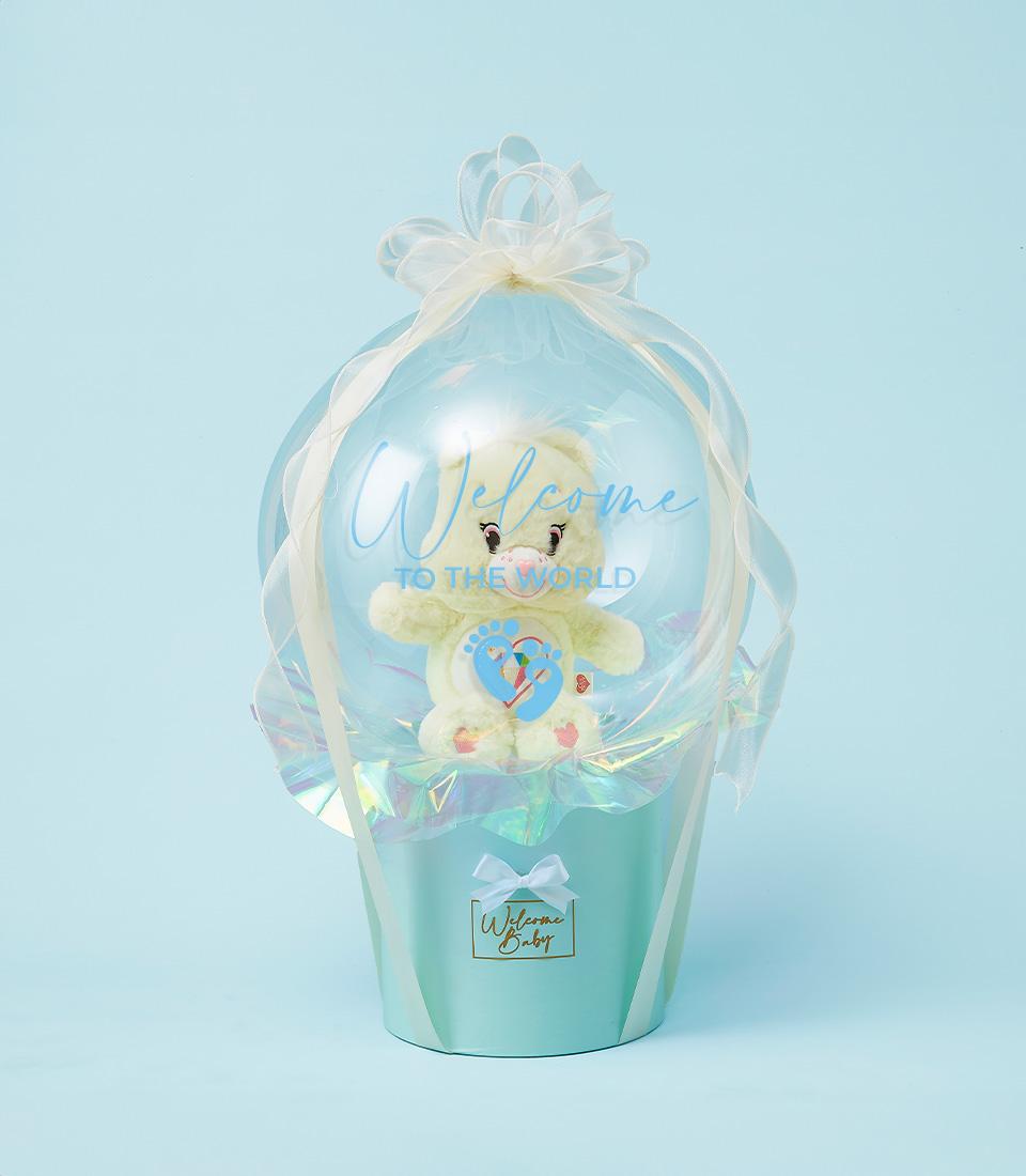 Light blue baby gift hamper with Care Bears teddy in clear balloon, Welcome to the World design