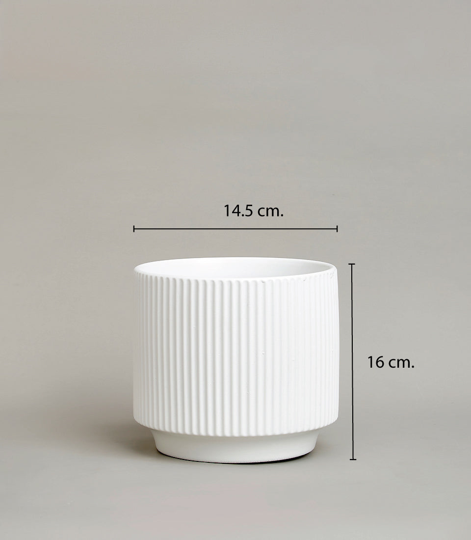 White ceramic vase with vertical ridges, elegant modern planter for fresh flowers or décor