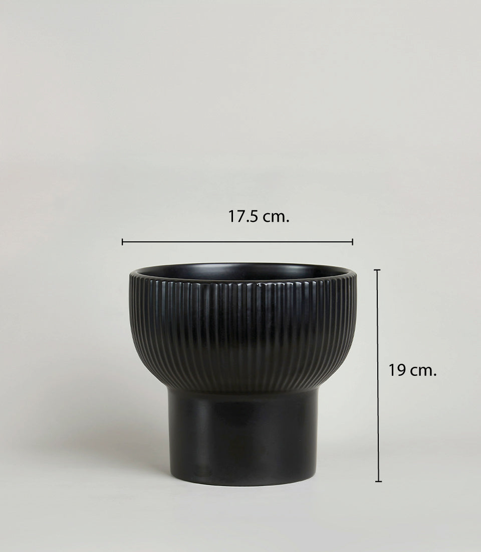 Deep magenta real touch orchid in textured black ceramic planter