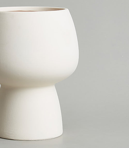 Modern off-white ceramic planter vase with tapered cylindrical base and matte finish