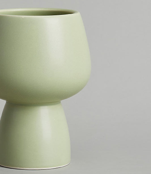 Light green ceramic chalice vase with matte finish and tapered silhouette for modern home décor