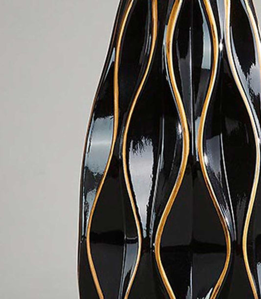 Midnight Waves black ceramic vase with sculptural gold-striped fluted design