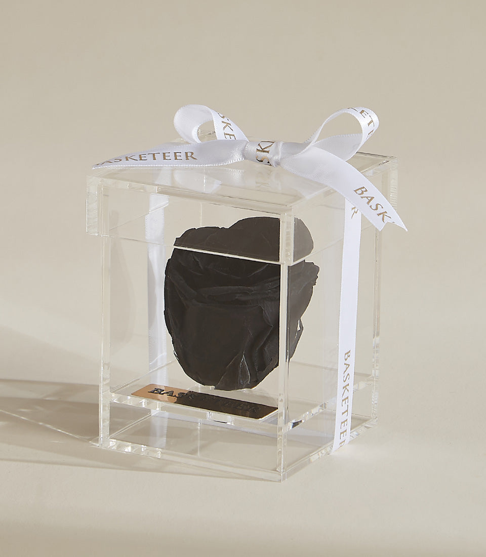 Black preserved rose in clear acrylic box with gold plaque and white satin ribbon