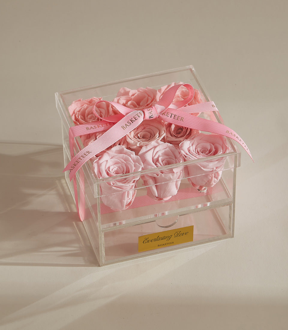 Light pink preserved roses in acrylic box with pink ribbon, luxury Valentine's Day gift by Flowers by Basketeer