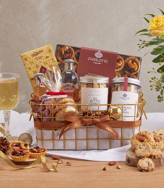 Premium chocolate and British cookie gourmet gift basket with gold wire design, brown ribbon, and artisan treats