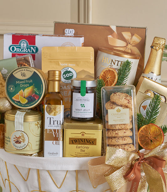 Luxury gold gourmet gift basket with premium coffee, olive oil, tea, and sparkling wine for New Year celebrations