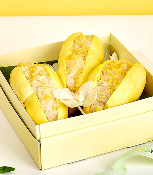 Monthong durian sticky rice gift box with mung beans and banana leaf presentation